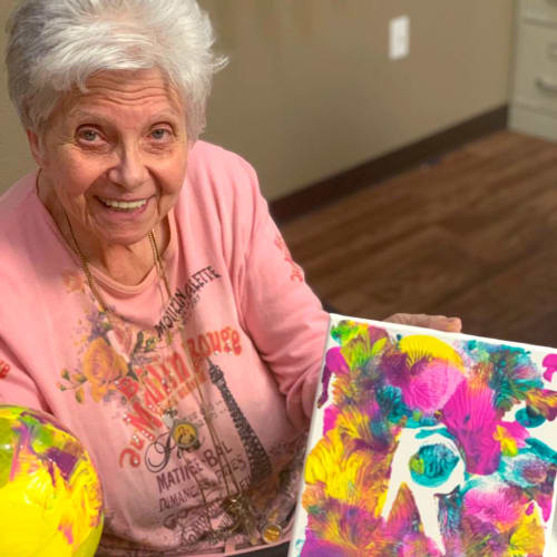 A happy resident with a painting project at FountainBrook in Midwest City, Oklahoma