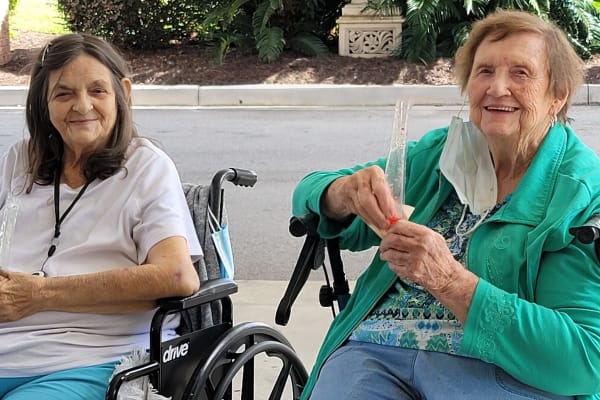 Residents enjoying time outside together at Carolina Gardens at Lexington in Lexington, South Carolina