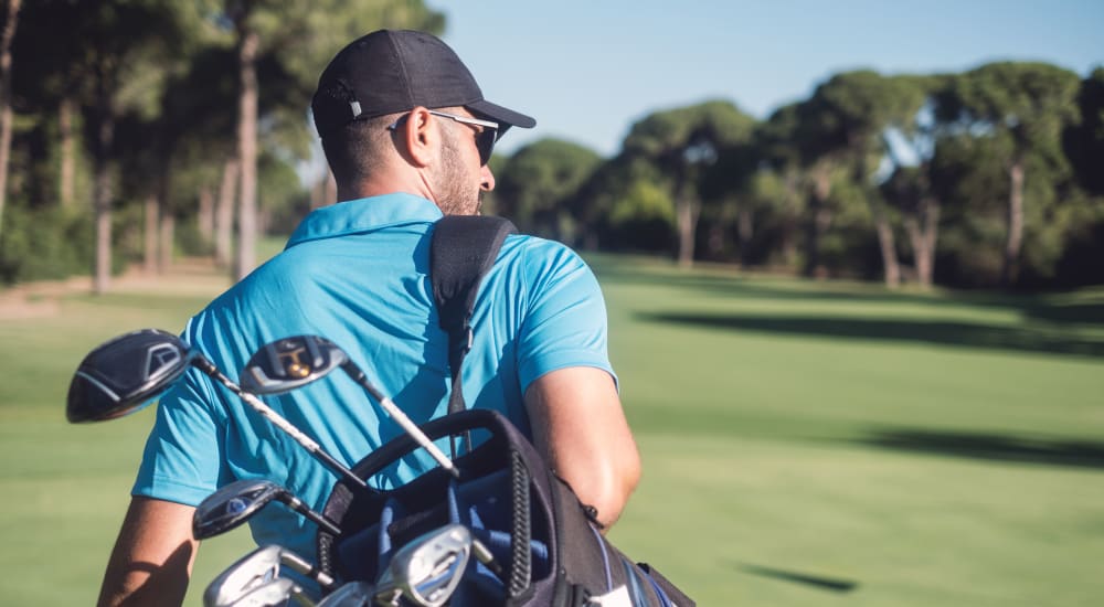 A resident golfing near Luxia Grand Prairie in Grand Prairie, Texas