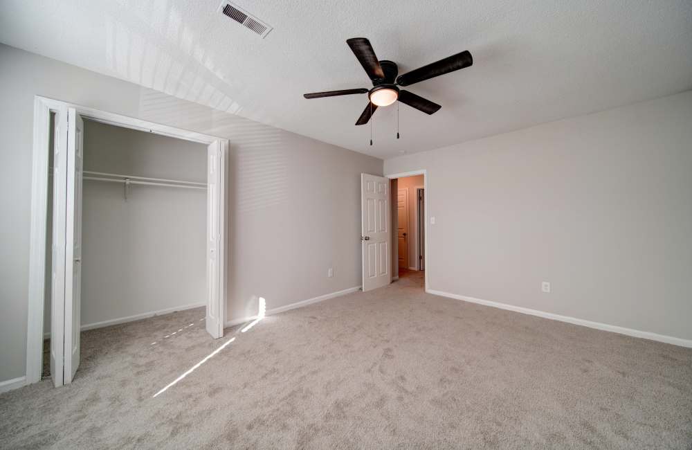 Bedroom with closet and connecting room at Arlington Village Townhomes in Greenville, North Carolina