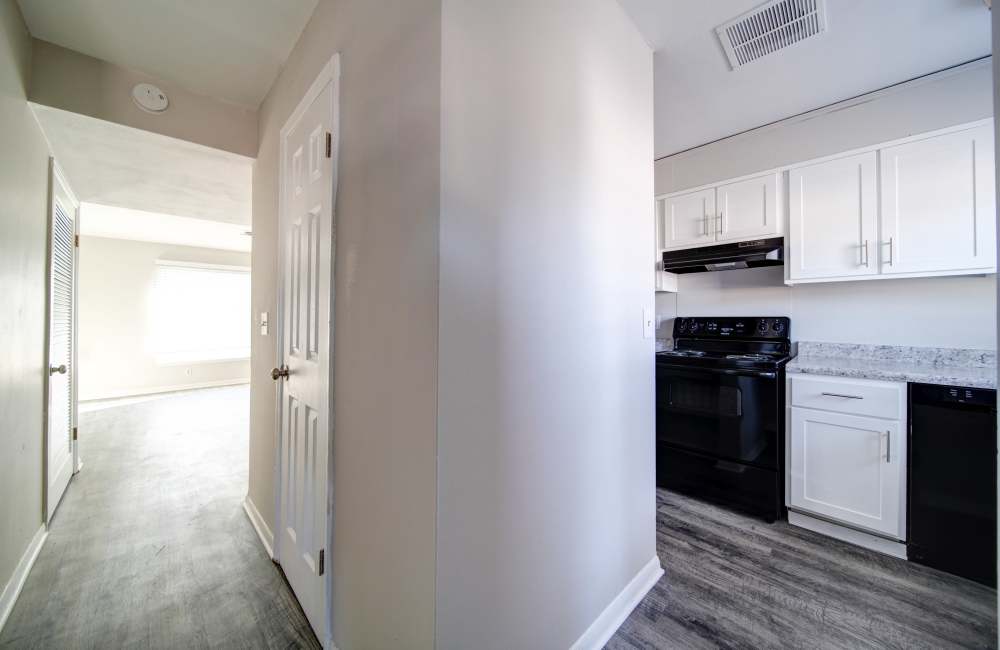 Kitchen wall separating living space at Arlington Village Townhomes in Greenville, North Carolina