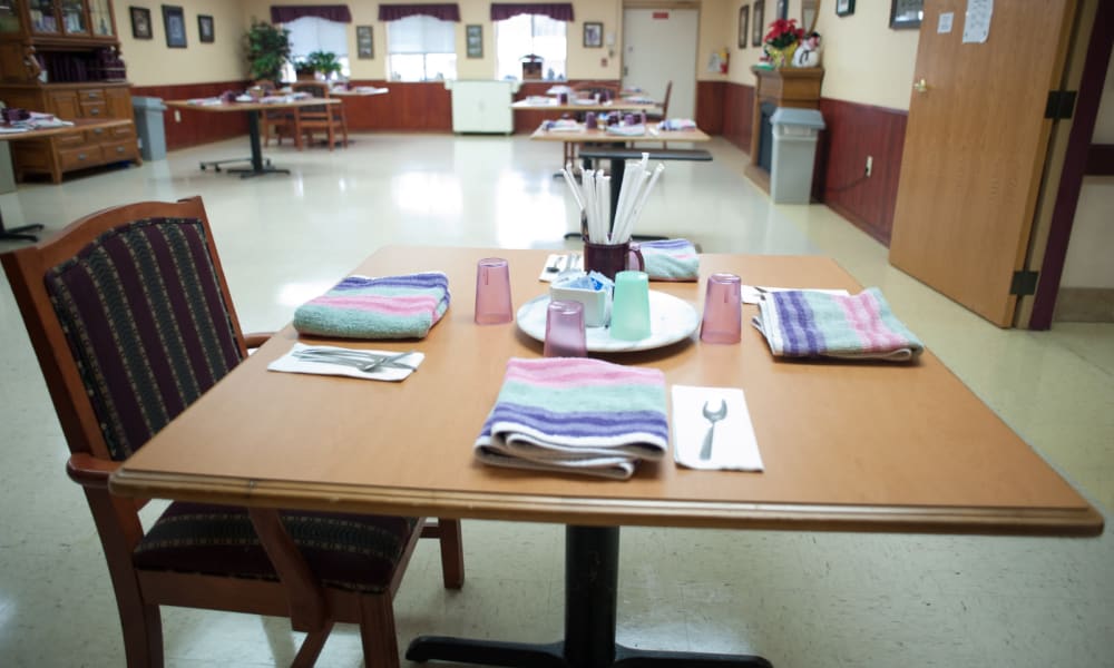 Dining room area and tables set for dinner at Montello Care Center in Montello, Wisconsin