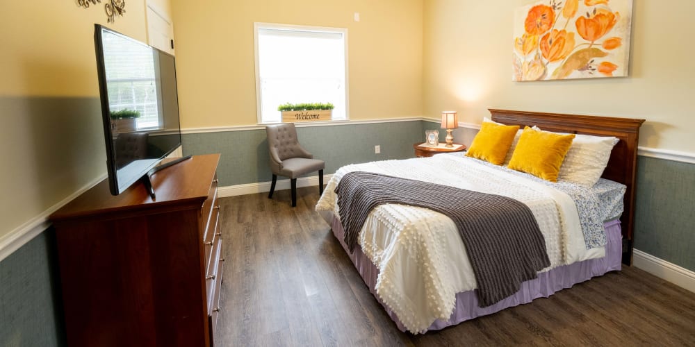 Comfortable bedroom at The Heritage Memory Care in The Woodlands, Texas