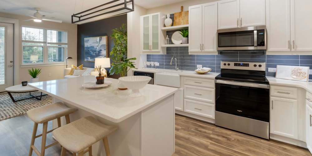 Kitchen with white appliances at The Calvert in Charlotte, North Carolina