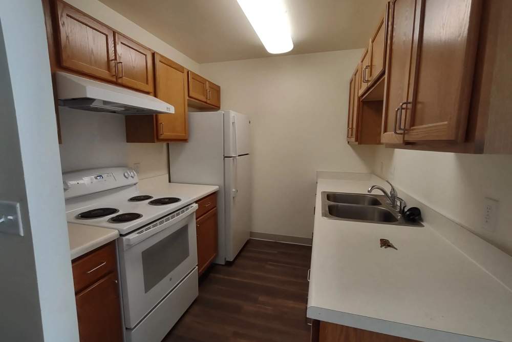 Kitchen with the necessary equipment at Willow Creek Apartments in Escanaba, Michigan