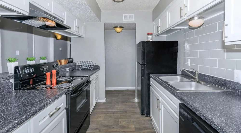 Kitchen with premium granite countertops at Barcelo Apartment Homes in San Antonio, Texas