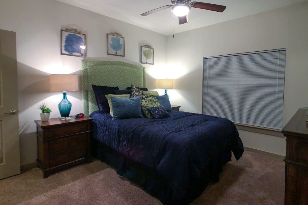 Model bedroom with ceiling fan and plush carpeting at Anatole on MacArthur in Oklahoma City, Oklahoma
