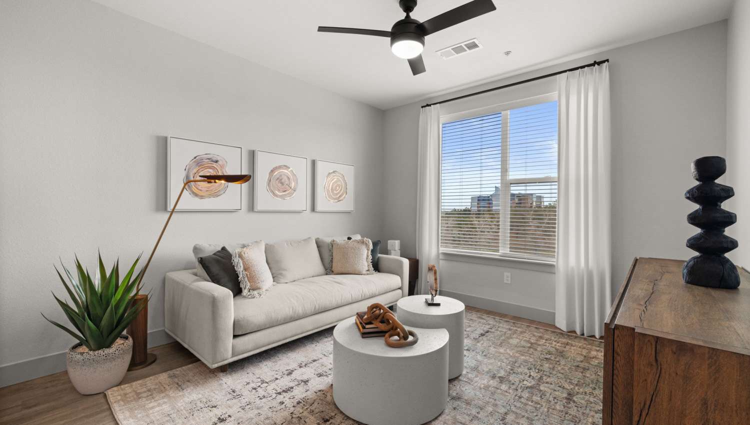 Living room with beautiful wall art at The Lock at Flatirons in Broomfield, Colorado