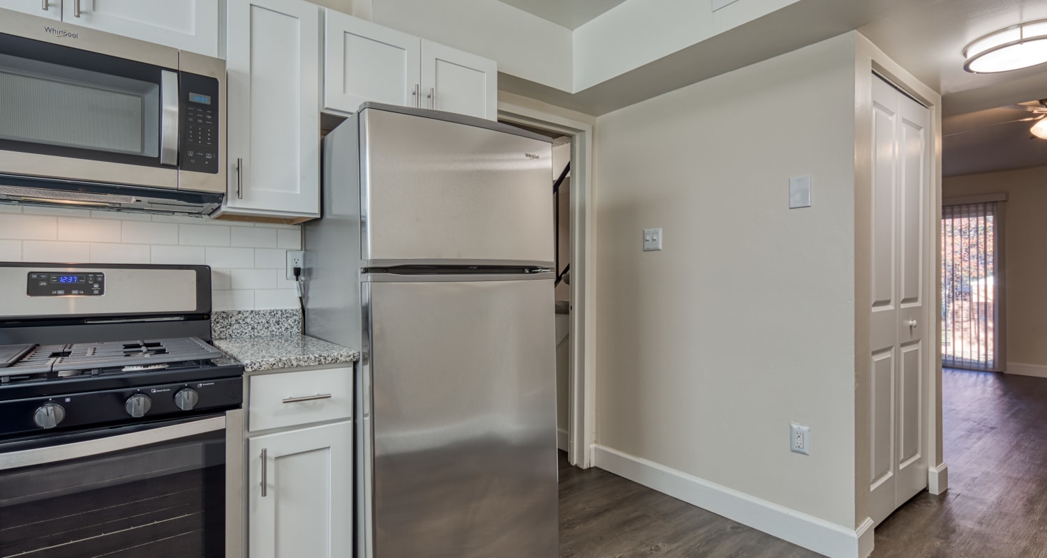 Stainless-steel appliances in an apartment kitchen at Millspring Commons in Richmond, Virginia