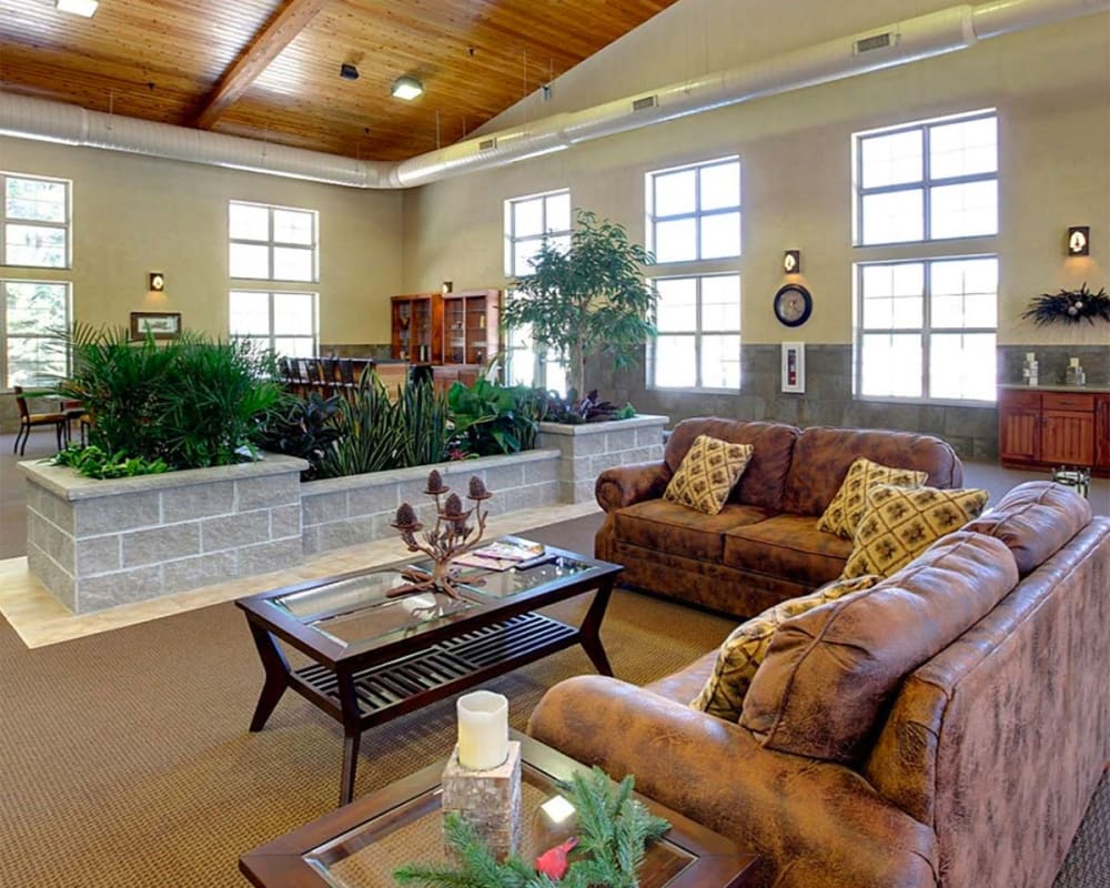 Spacious, bright common room with vaulted ceilings at Milestone Senior Living Eagle River in Eagle River, Wisconsin.