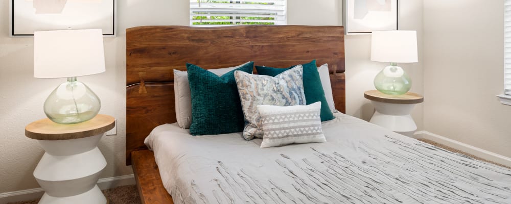 Well decorated bedroom in model home at Villas at Houston Levee West Apartments in Cordova, Tennessee