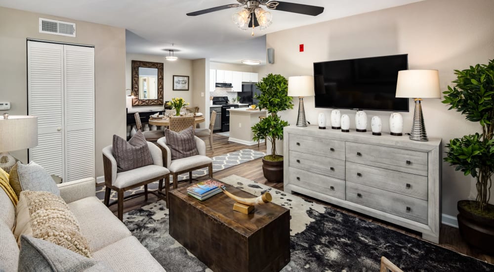 A furnished apartment living room and dining room at Heritage at Riverstone in Canton, Georgia