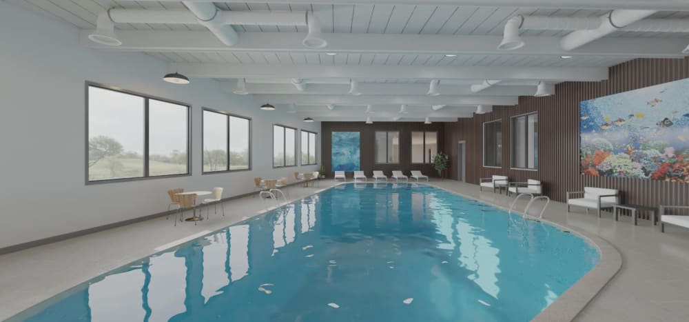 Rending of indoor pool with plenty of windows at  Thea Apartments in Tacoma, Washington