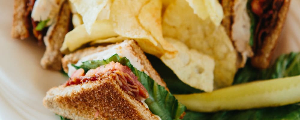 Club sandwich with potato chips at The Springs at Anna Maria in Medford, Oregon