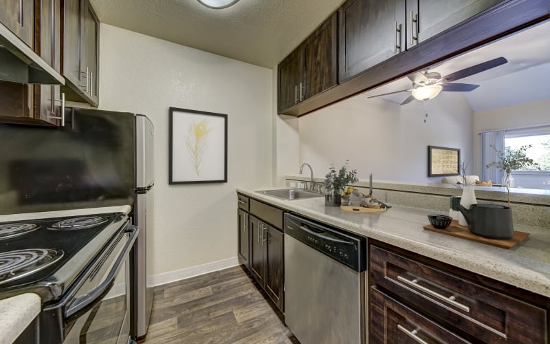 Spacious kitchen with plenty of counter space at The Timbers Apartments in Hayward, California