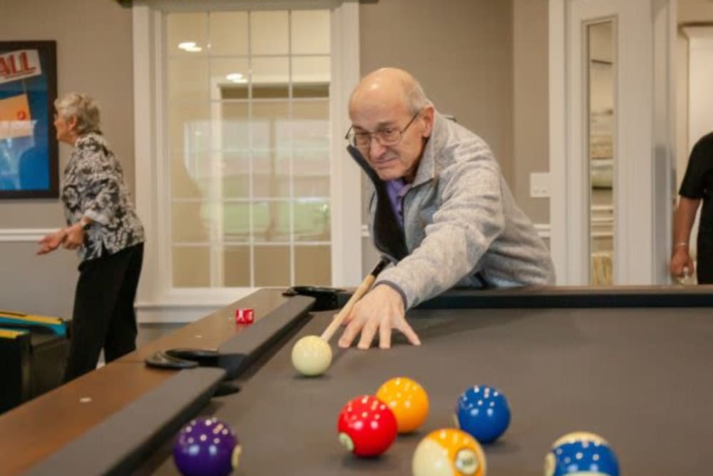 Resident playing pool at The Pinnacle in Plymouth Meeting, Pennsylvania