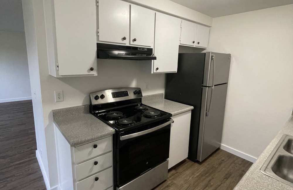 Kitchen with white cabinets at Parkside Apartments