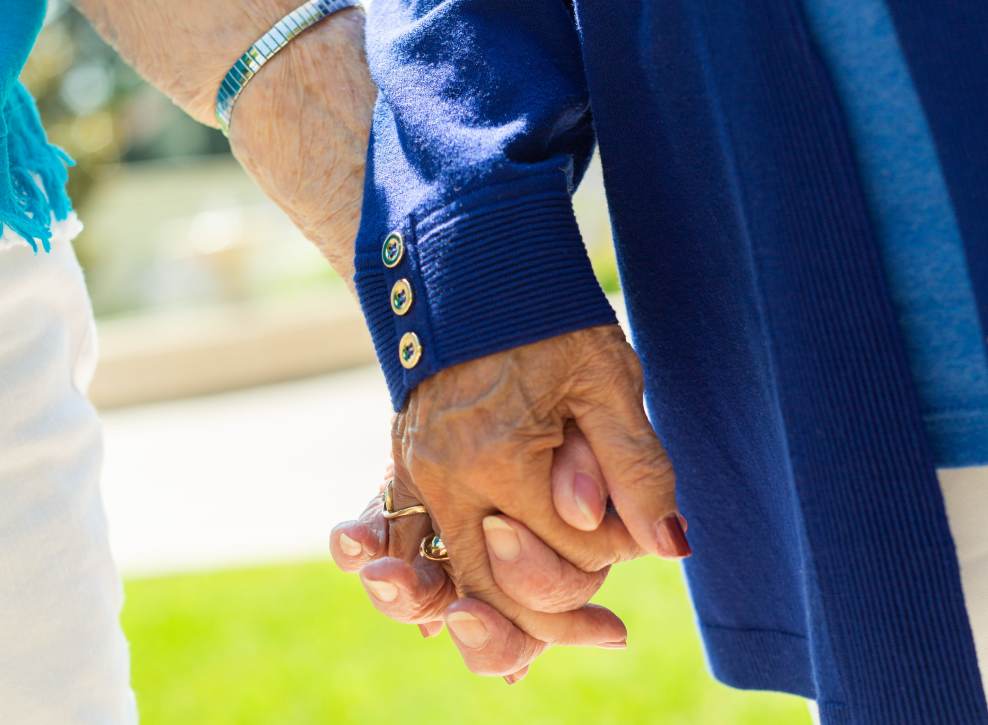 Residents holding hands at Murano in Seattle, Washington