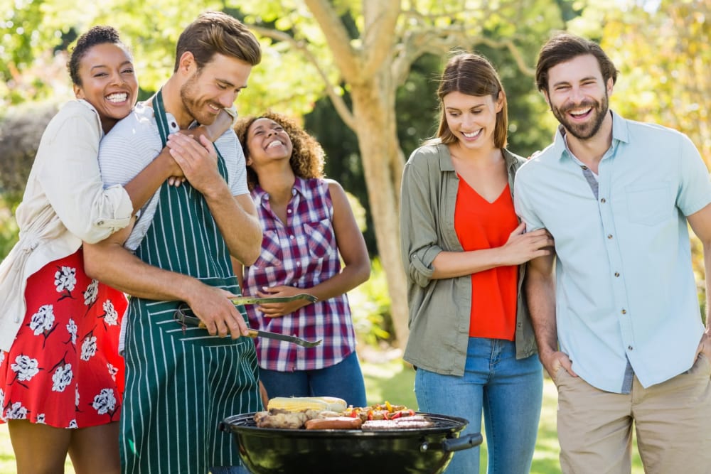 Residents and friends grilling at The Waterfront Apartments & Townhomes in Munhall, Pennsylvania