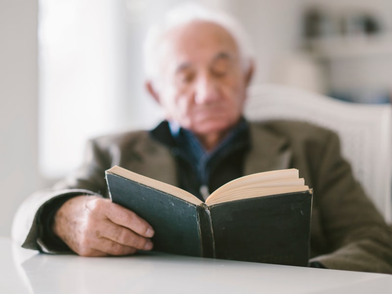 Resident reading a book at Fair Oaks Health Care Center in Crystal Lake, Illinois