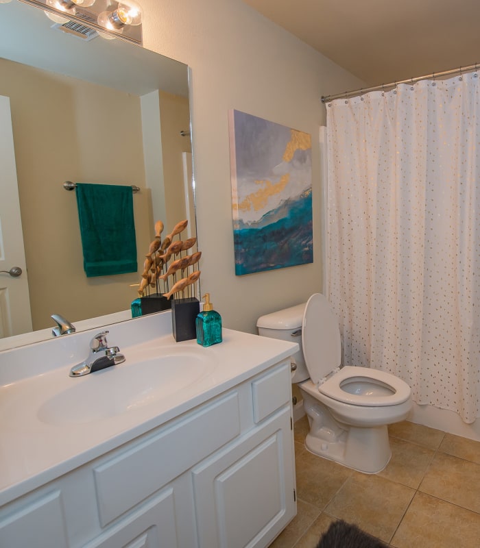 Bathroom with tile flooring at Lexington Park Apartment Homes in North Little Rock, Arkansas