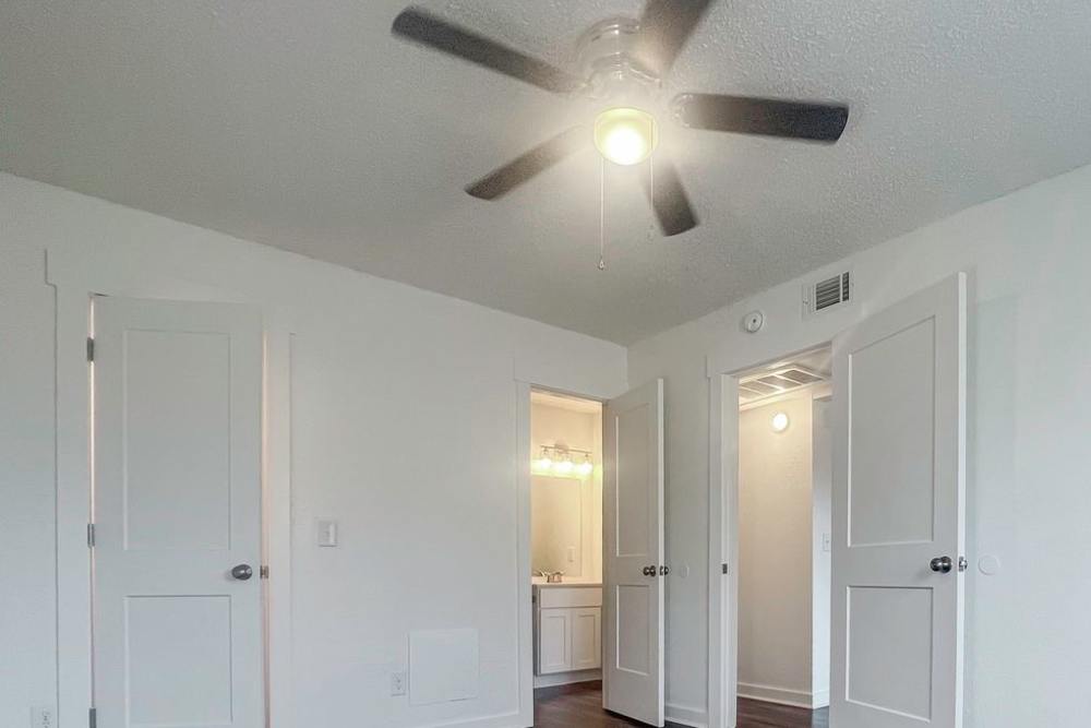 Bedroom with a ceiling fan at Kickingbird & Kickingbird Hills in Edmond,Oklahoma