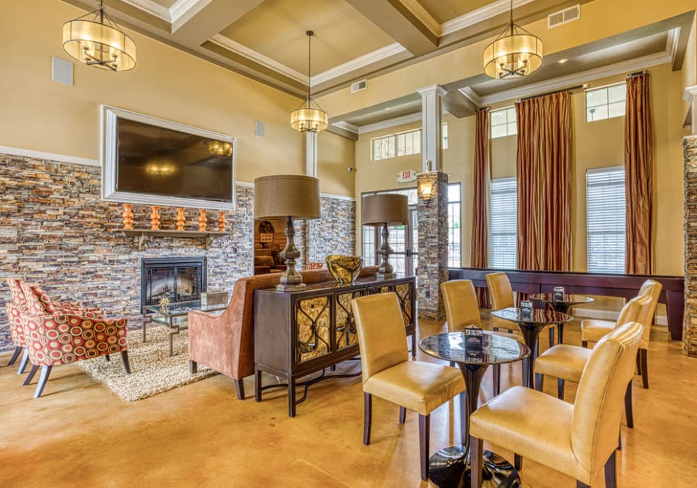 Clubhouse with seating areas and televisions at Arrington Ridge in Round Rock, Texas