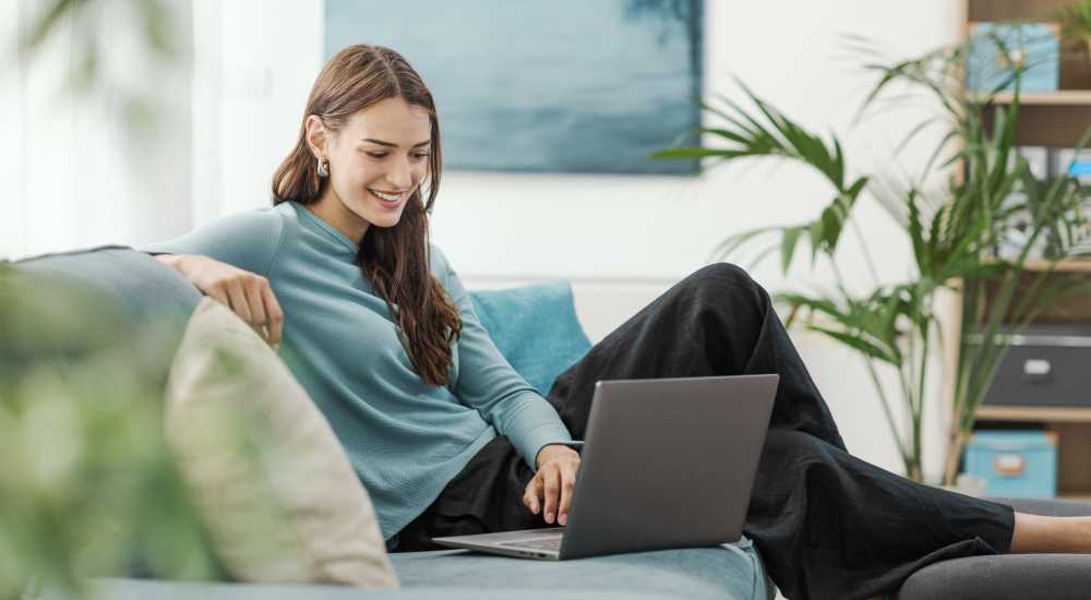Resident working in her home at Parkview Estates in Liberty City, Texas 