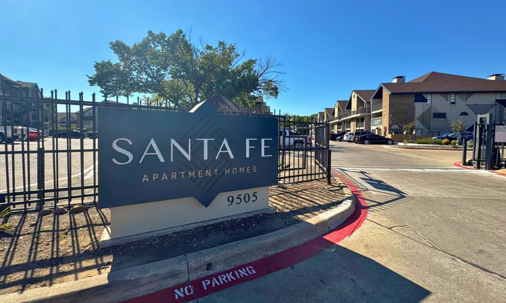 Monument signage at the entrance of the community at Santa Fe Apartments in Dallas, Texas