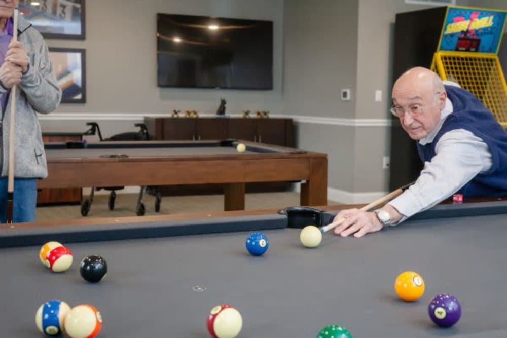 Resident playing pool at The Pinnacle in Plymouth Meeting, Pennsylvania