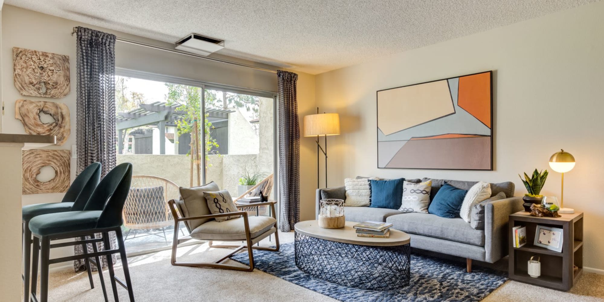 Spacious living room with a lot of natural light in a model home at Sofi Ventura in Ventura, California