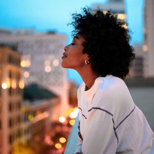 A resident enjoys the view from Aster, Long Beach, California