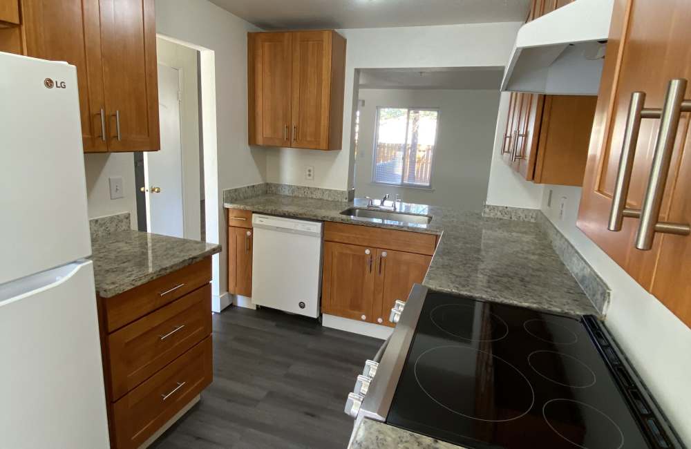 Kitchen with granite countertops at Evergreen Townhomes