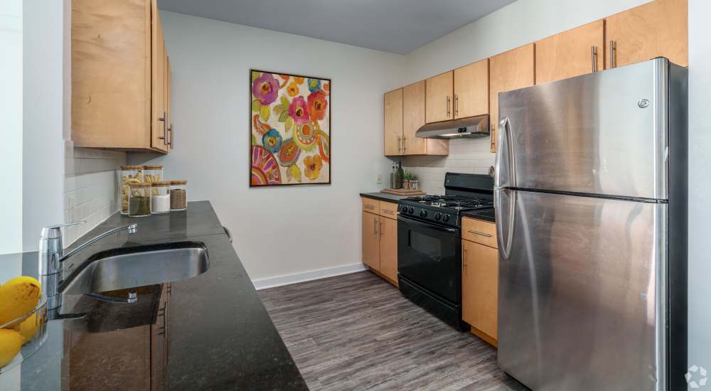 Open kitchen with stainless appliances at Paseo Verde in Philadelphia, Pennsylvania