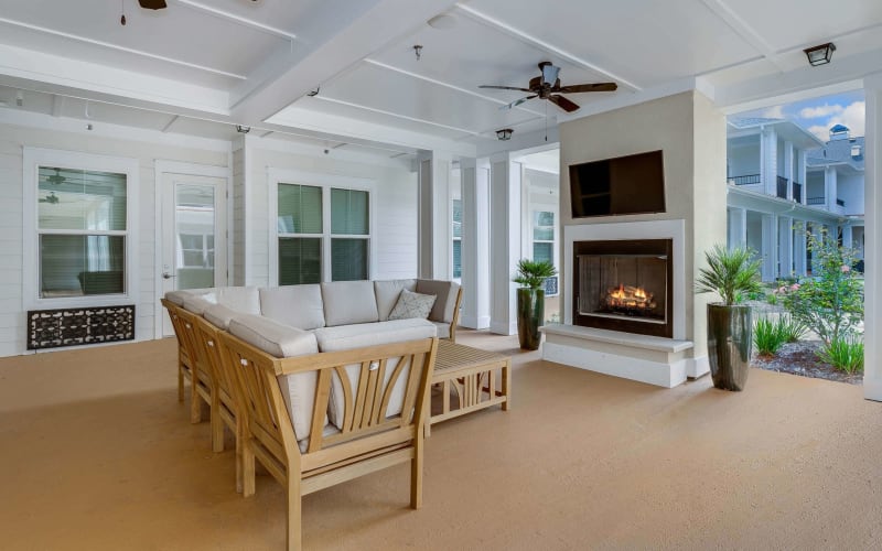 Fireplace lounge with access to the courtyard at The Blake at Pensacola in Pensacola, Florida