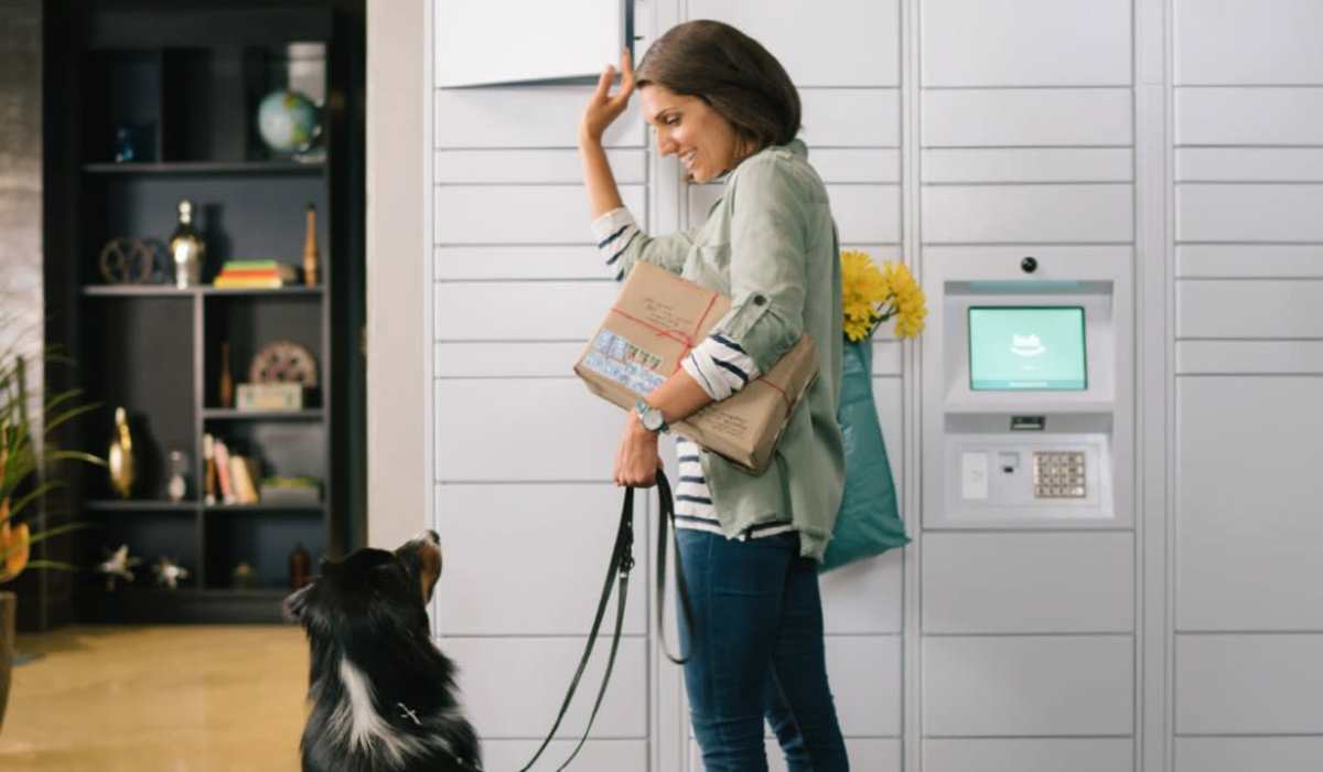Resident getting her package from the lockers at Muse Milford in Milford, Connecticut
