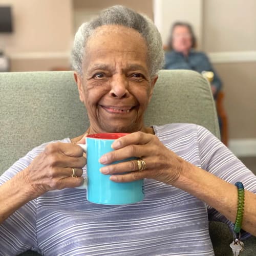 Resident with a cup of tea at FountainBrook in Midwest City, Oklahoma