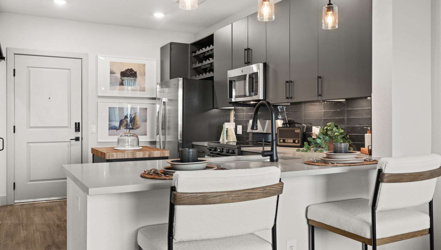 Kitchen with modern appliances at The Lock at Flatirons in Broomfield, Colorado