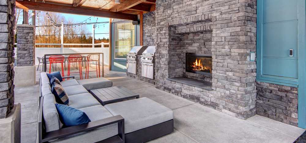 An outdoor fireplace with bbq and grilling station at Allegro in Lynnwood, Washington 