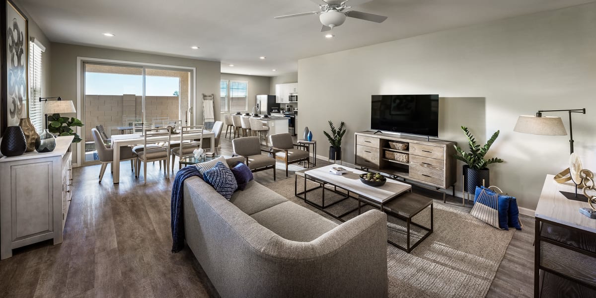 Spacious and well lit living room in a model home at Las Casas at Windrose in Litchfield Park, Arizona