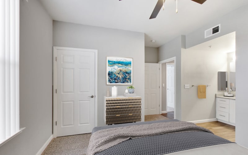 Spacious master bedroom with plush carpeting at Natomas Park Apartments in Sacramento, California