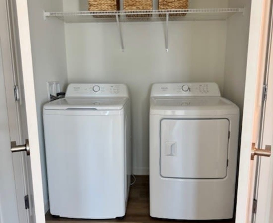Washer and dryer in a closet at Pritchard Park Place in Racine, Wisconsin