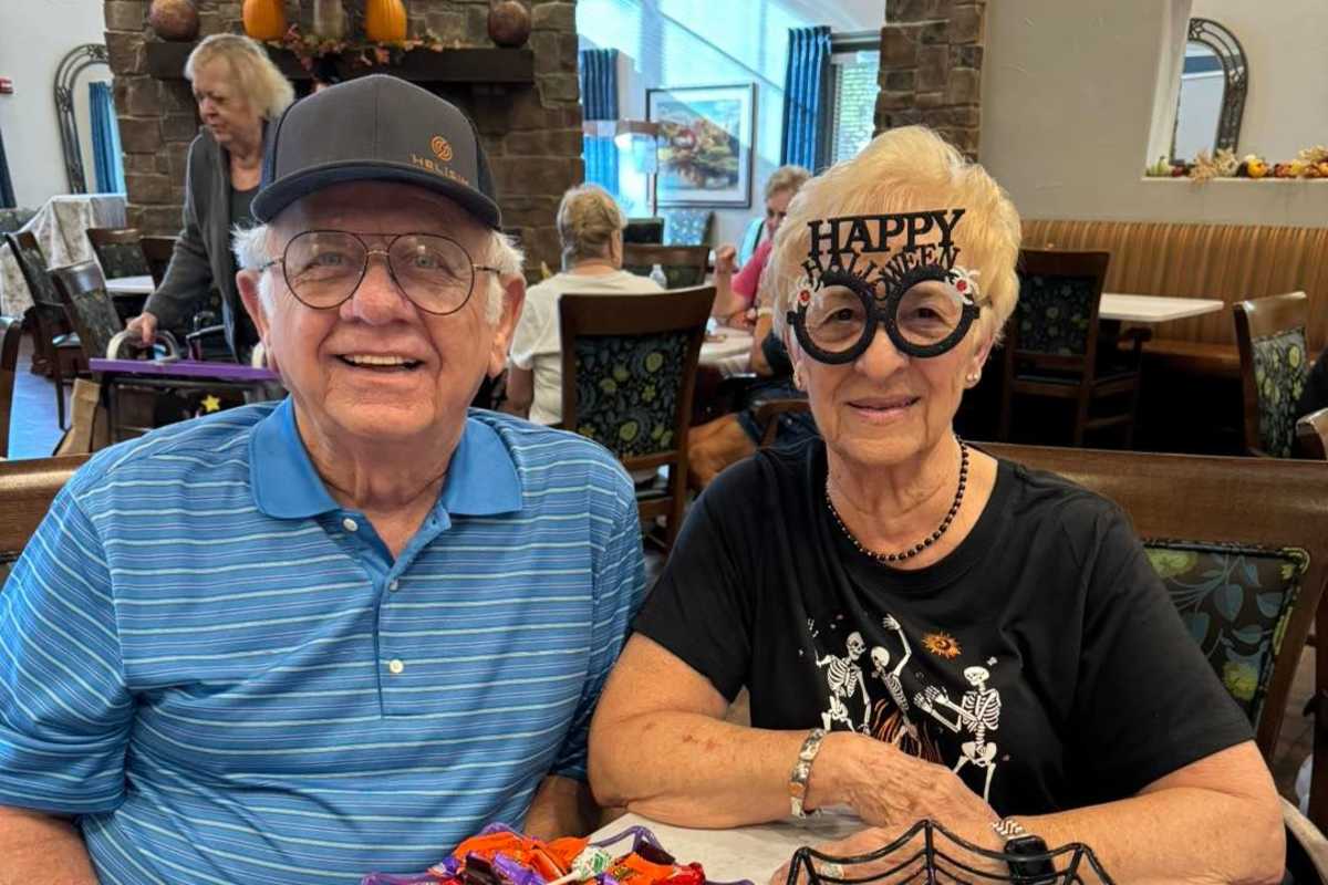 A couple in Halloween theme'd attire at Watercrest at Mansfield in Mansfield, Texas.