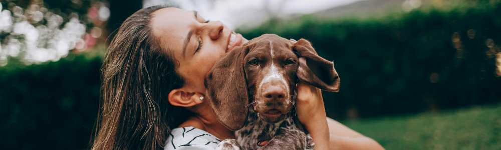 Resident enjoying with her pet at St. Albans Lofts in Raleigh, North Carolina,