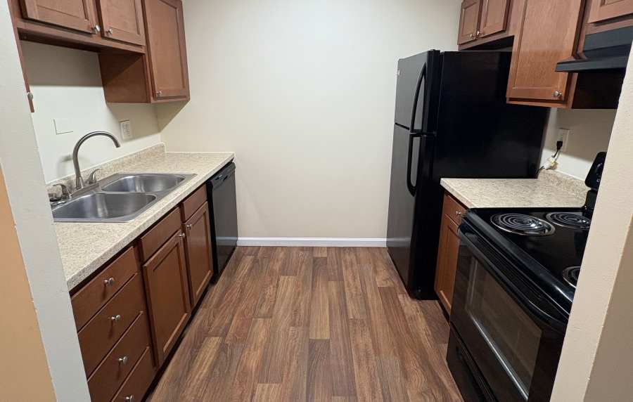 Modern kitchen with appliances at Edgewood Group Apartments in Merrillville, Indiana