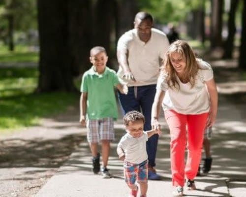 Family walking around Rochester, New York near East Ridge Manor Apartmentsi