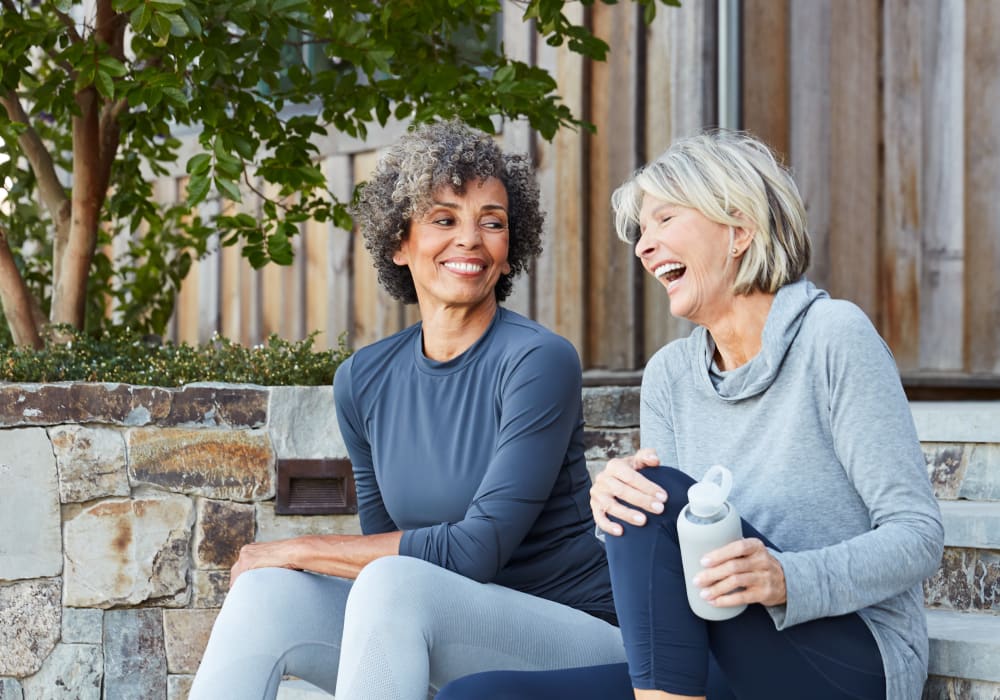 Residents chatting on the steps outside their home after a workout in the fitness center at Sofi Irvine in Irvine, California