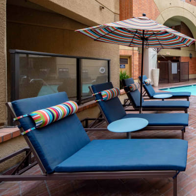 Lounge chairs near the spa at Sofi at 3rd in Long Beach, California