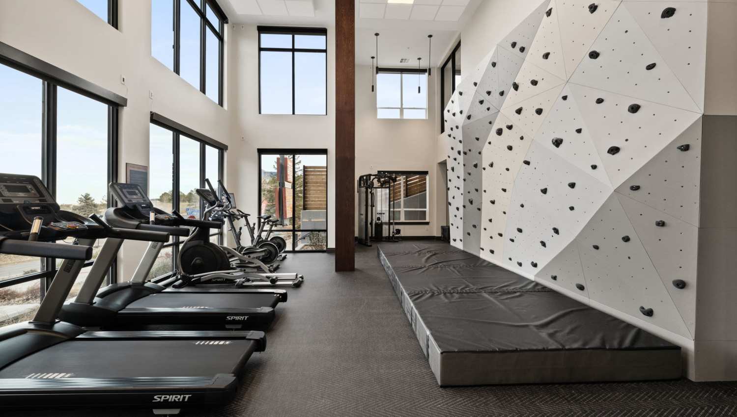 Fitness center with cardio and strength equipment at The Lock at Flatirons in Broomfield, Colorado