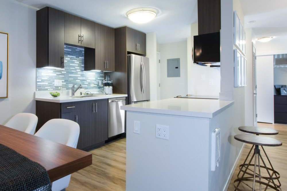 Stainless-steel appliances in apartment kitchen at Belmont Glen Residences in Belmont, California